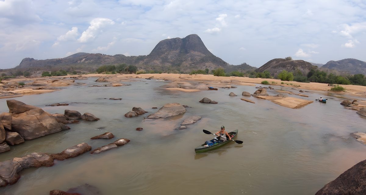 Guests canoeing a quiet stretch of the Ruvuma River