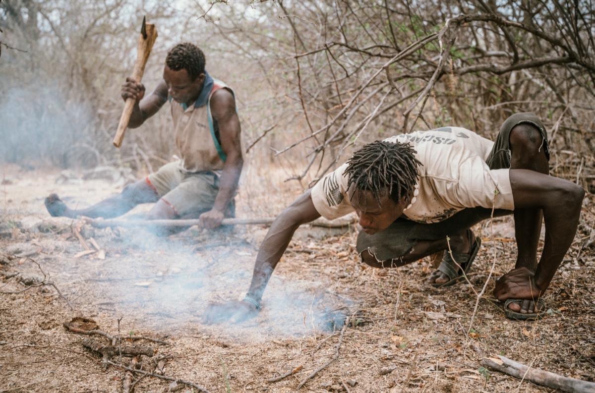 Hadza community members by the fire in the Yaeda Valley